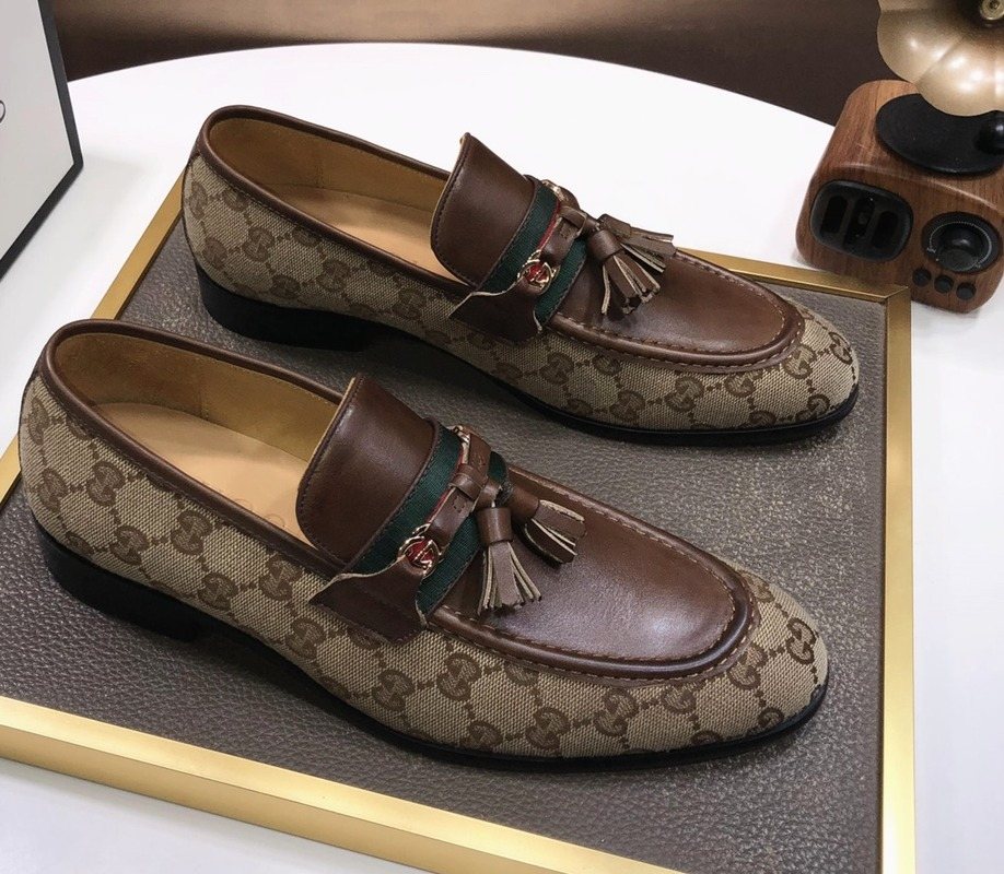 Gucci Monogram Tassel Loafers